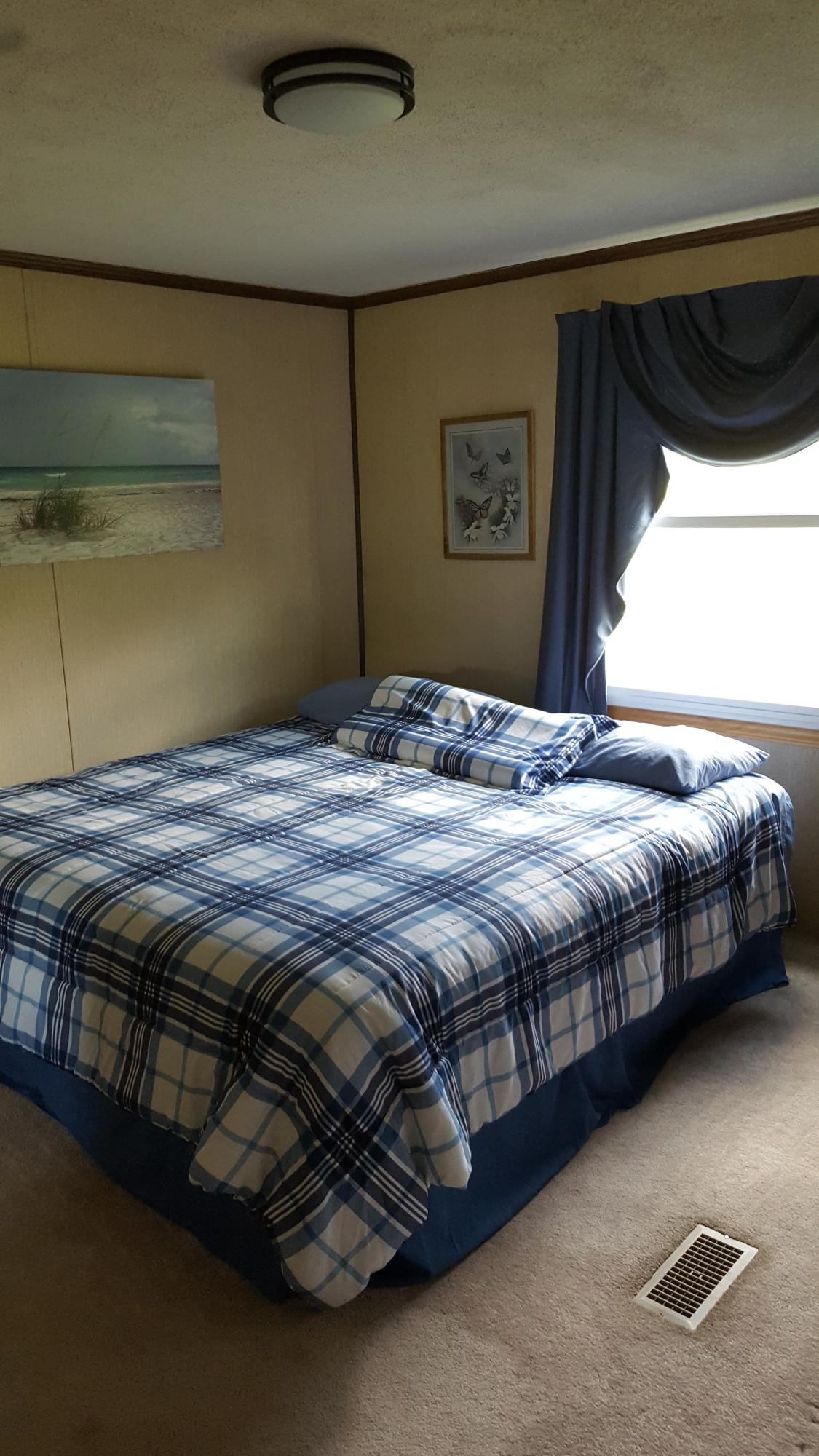 2771 Rutrough Road Southeast Roanoke, VA 24014 - Photo 13 of 31 a bedroom with a bed and a window