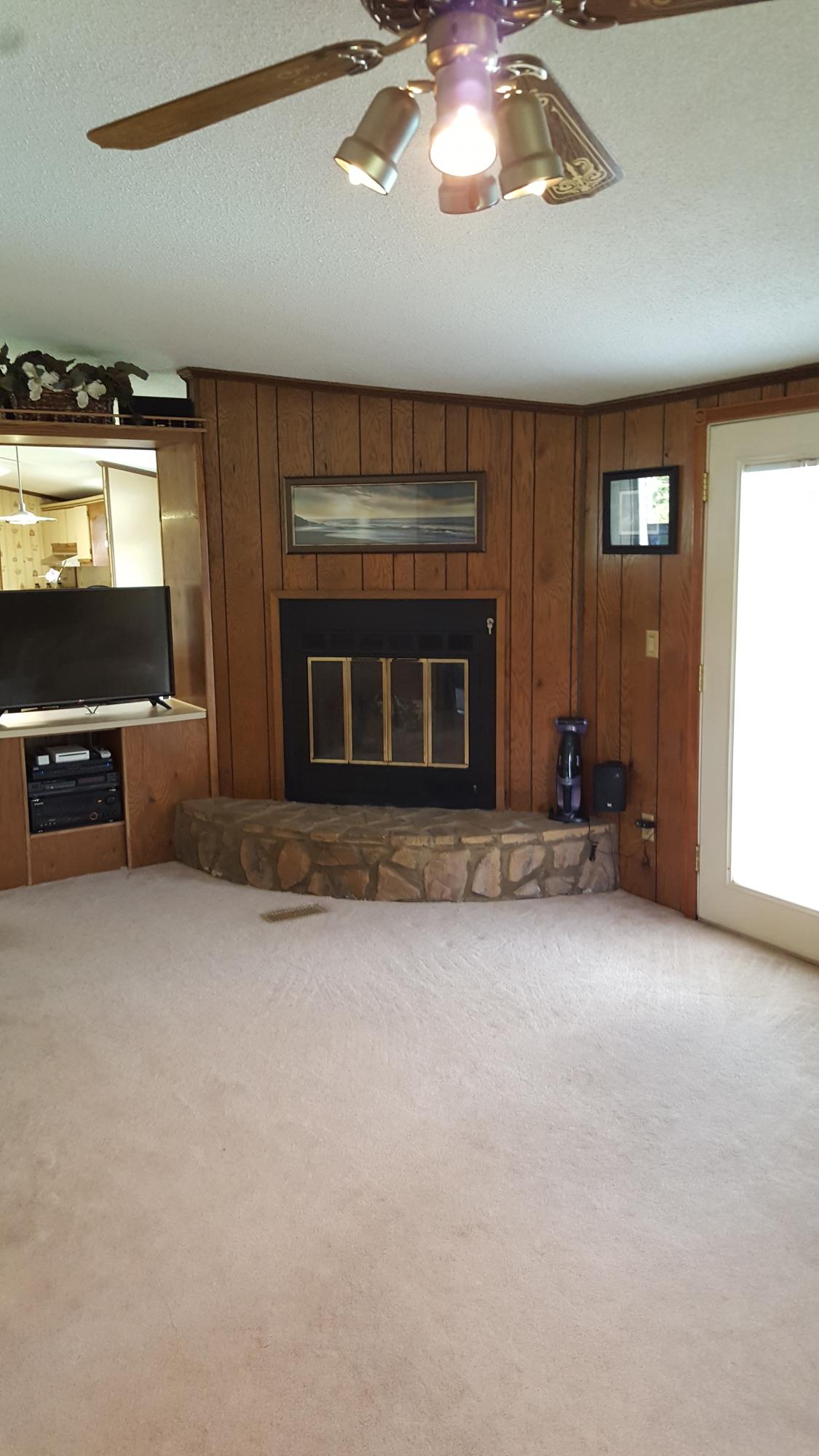2771 Rutrough Road Southeast Roanoke, VA 24014 - Photo 14 of 31 wooden floor fireplace and windows in a room