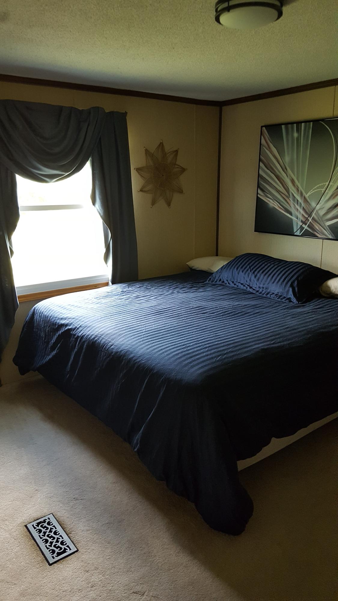 2771 Rutrough Road Southeast Roanoke, VA 24014 - Photo 15 of 31 a bedroom with a bed and a window