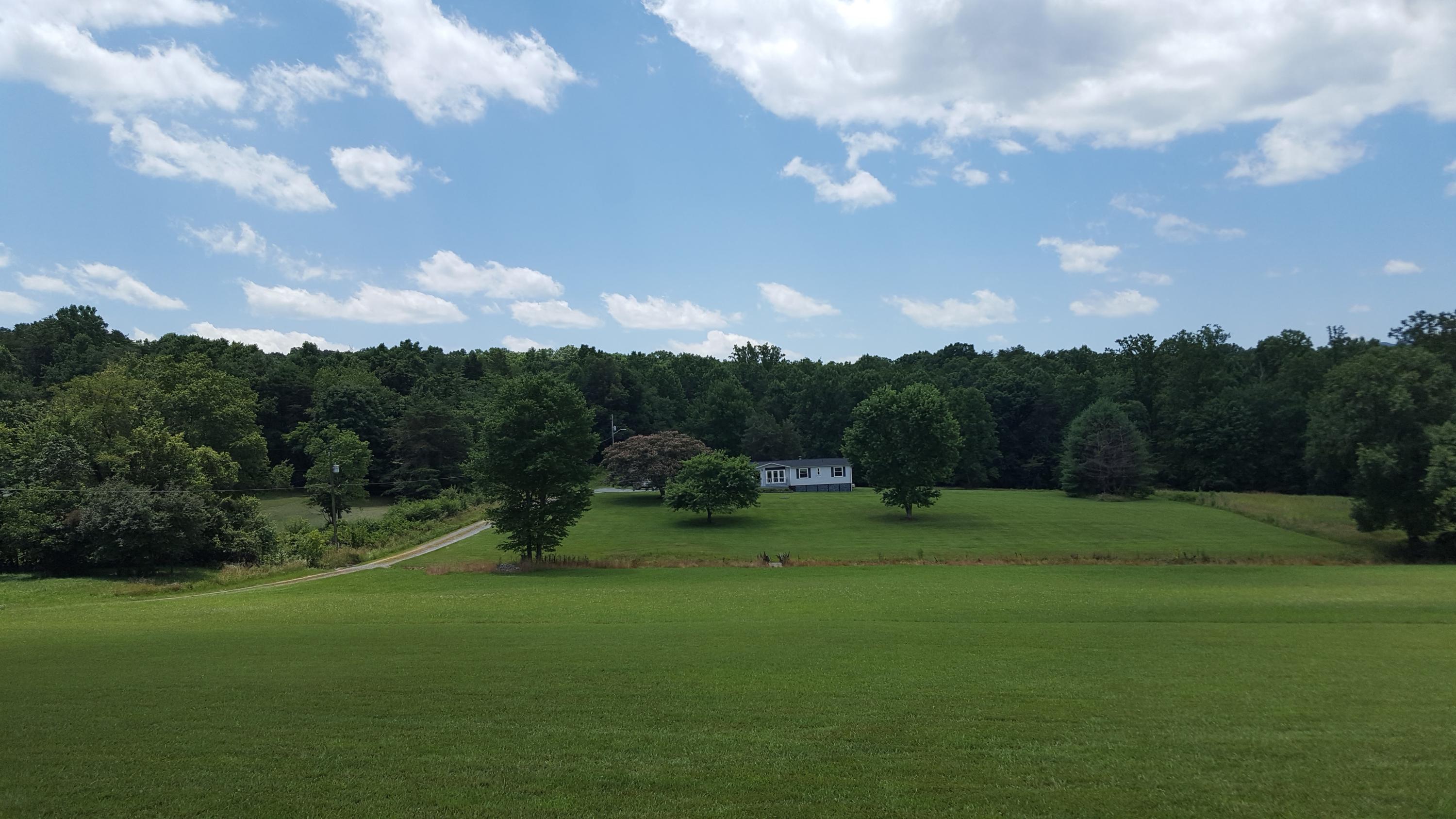 2771 Rutrough Road Southeast Roanoke, VA 24014 - Photo 3 of 31 a view of outdoor space with green field and trees