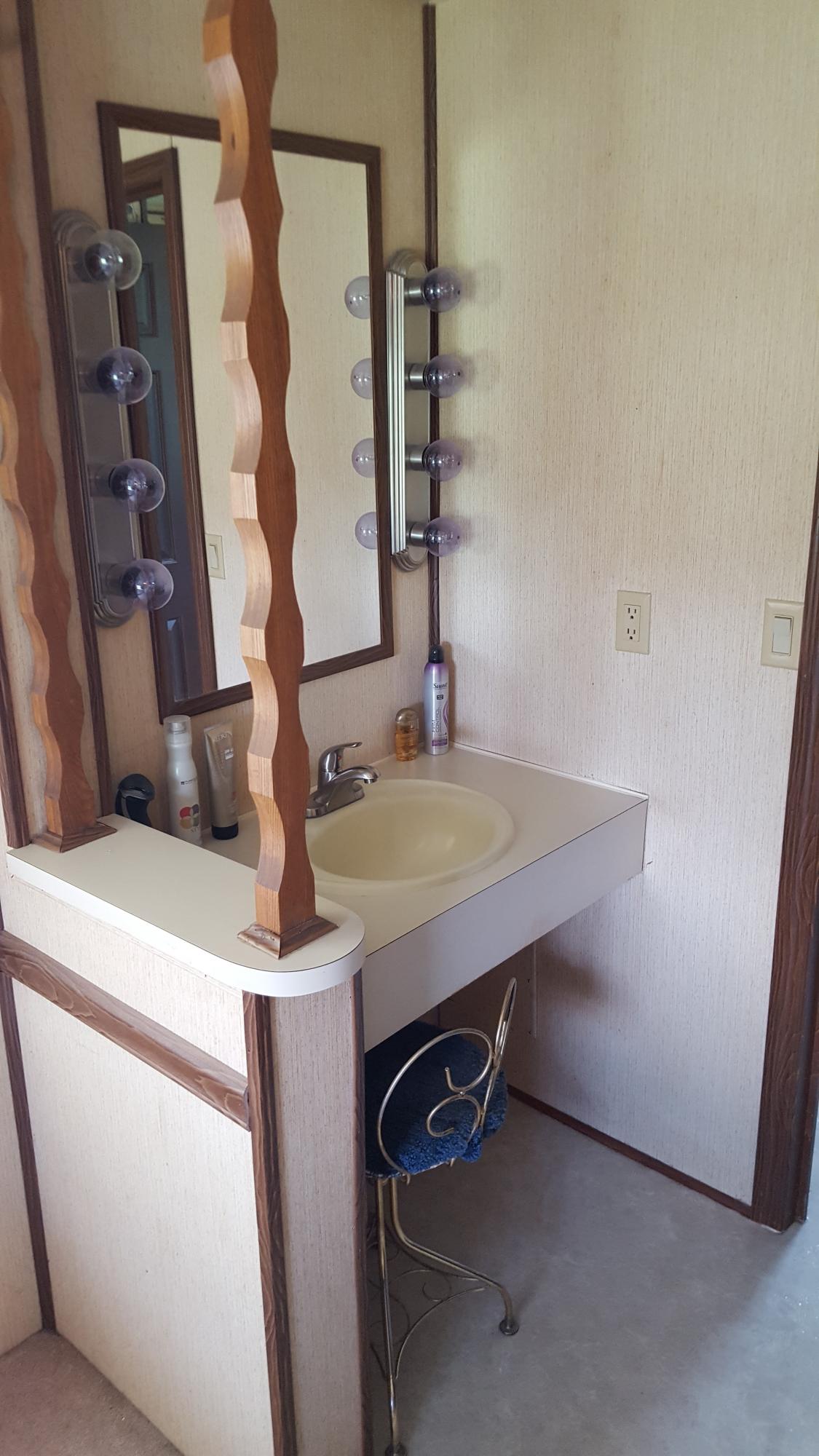 2771 Rutrough Road Southeast Roanoke, VA 24014 - Photo 21 of 31 a bathroom with a sink and a mirror