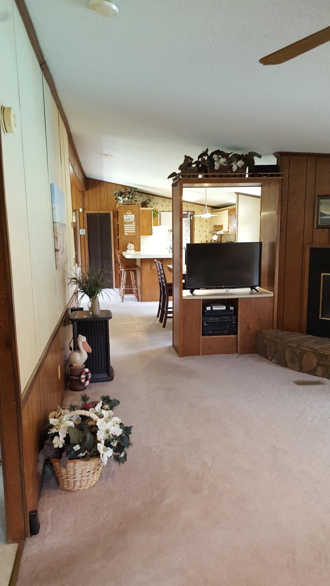 2771 Rutrough Road Southeast Roanoke, VA 24014 - Photo 27 of 31 a living room with furniture and a flat screen tv