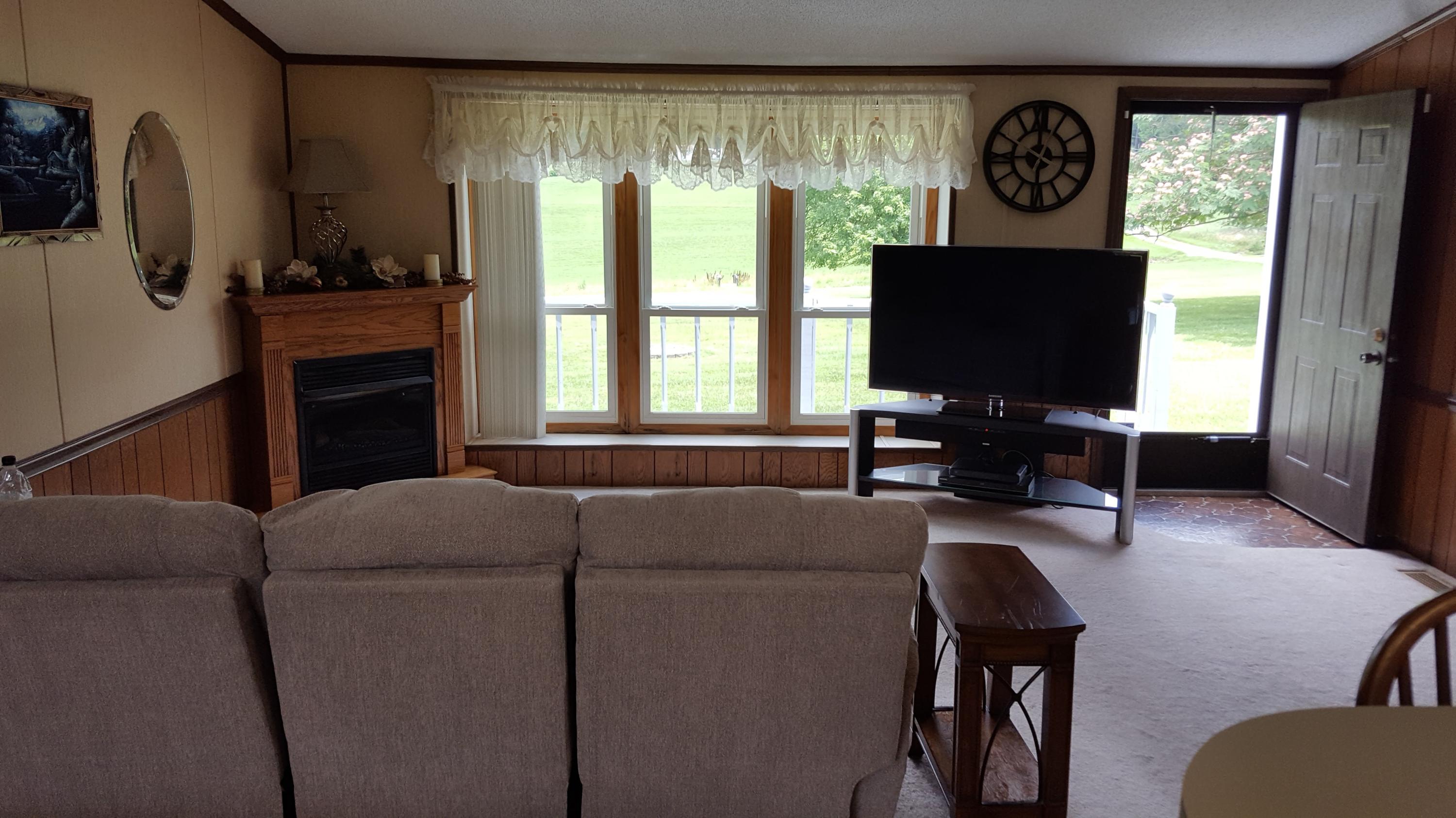 2771 Rutrough Road Southeast Roanoke, VA 24014 - Photo 7 of 31 a living room with furniture and a flat screen tv