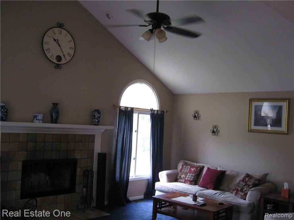 23880 Hall Road Trenton, MI 48183 - Photo 16 of 50 Large family room with vaulted ceilings and ceiling fan!