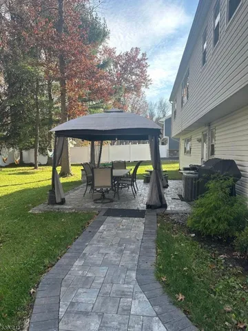 a view of yard with swimming pool