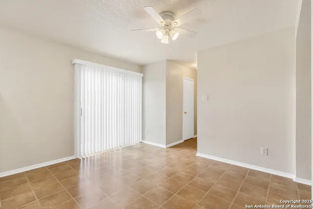 a kitchen with granite countertop a refrigerator and a stove top oven