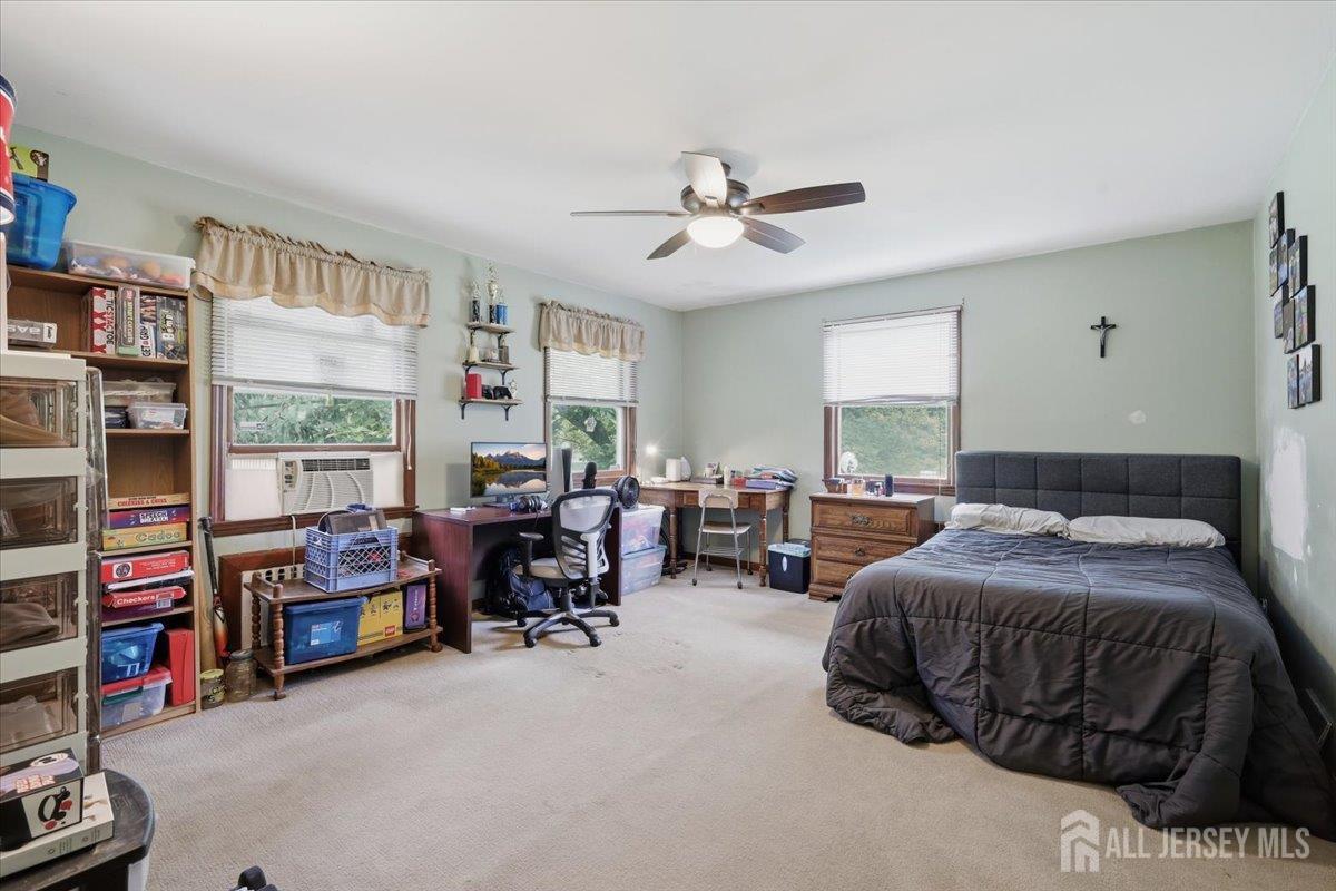 33 Ellison Road Somerset, NJ 08873 - Photo 16 of 38 a bedroom with furniture and a large window