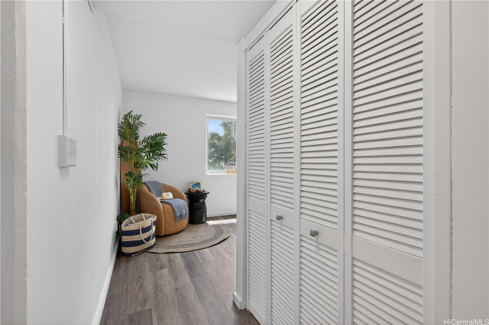98-1038 Moanalua Road, Unit 7608 Aiea, HI 96701 - Photo 14 of 25 a view of a room that has a couch and a potted plant