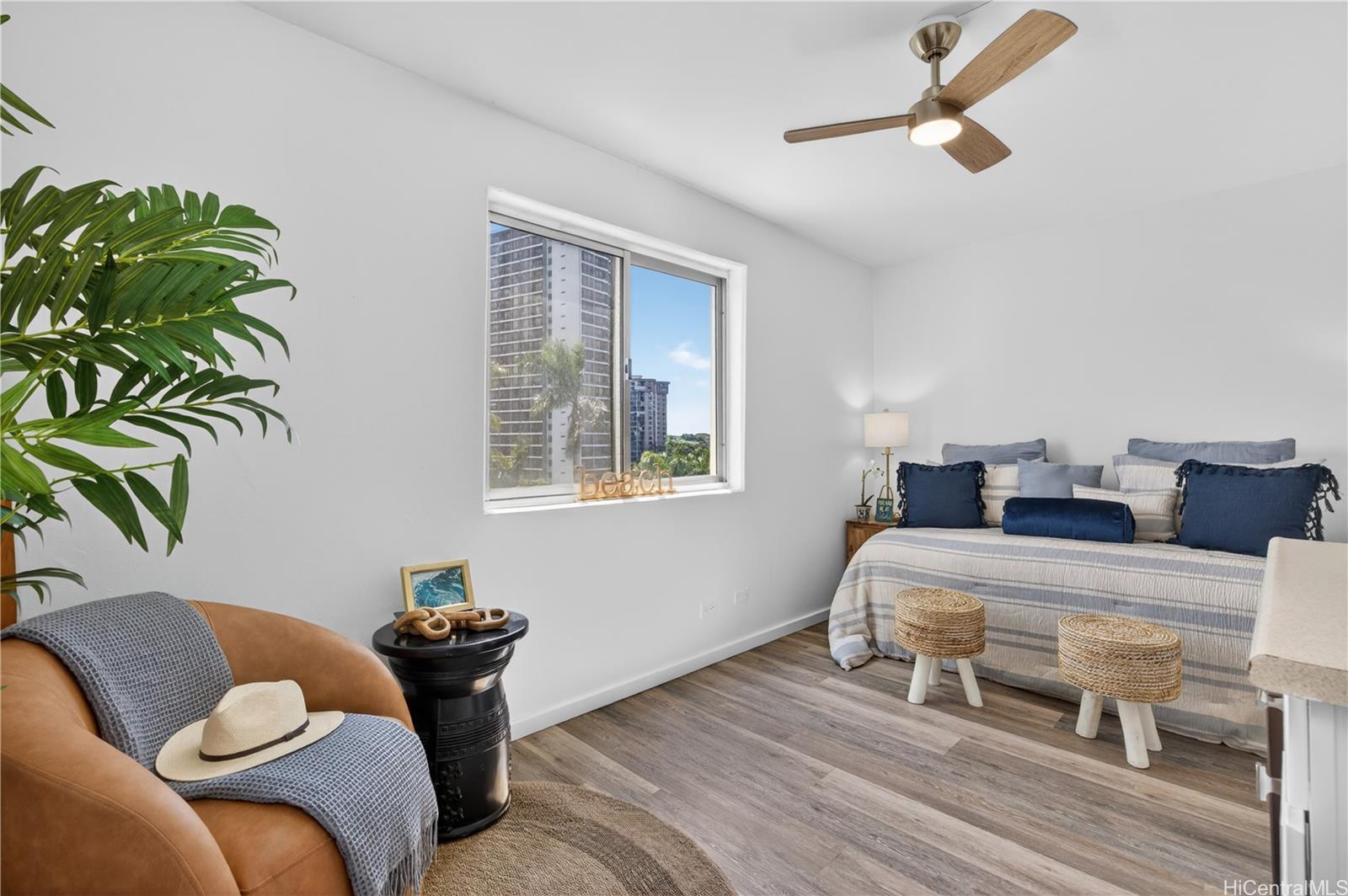 98-1038 Moanalua Road, Unit 7608 Aiea, HI 96701 - Photo 15 of 25 a bedroom with furniture and a potted plant