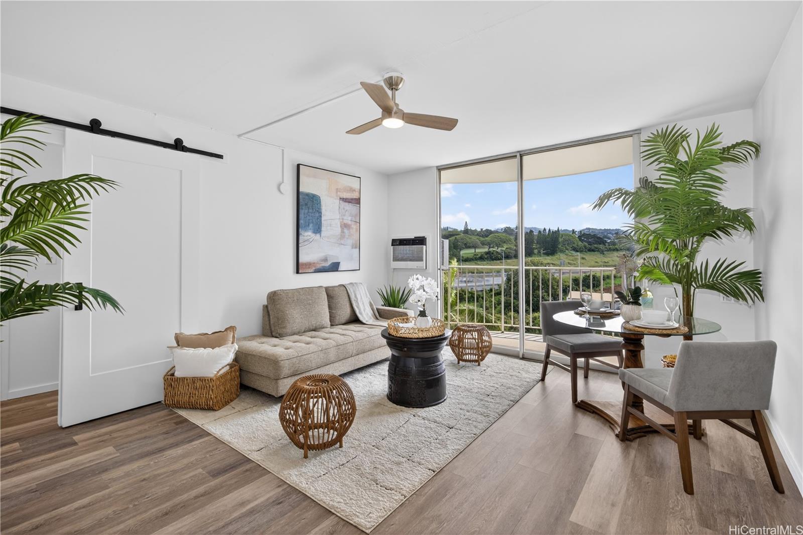 98-1038 Moanalua Road, Unit 7608 Aiea, HI 96701 - Photo 2 of 25 a living room with furniture and a large window