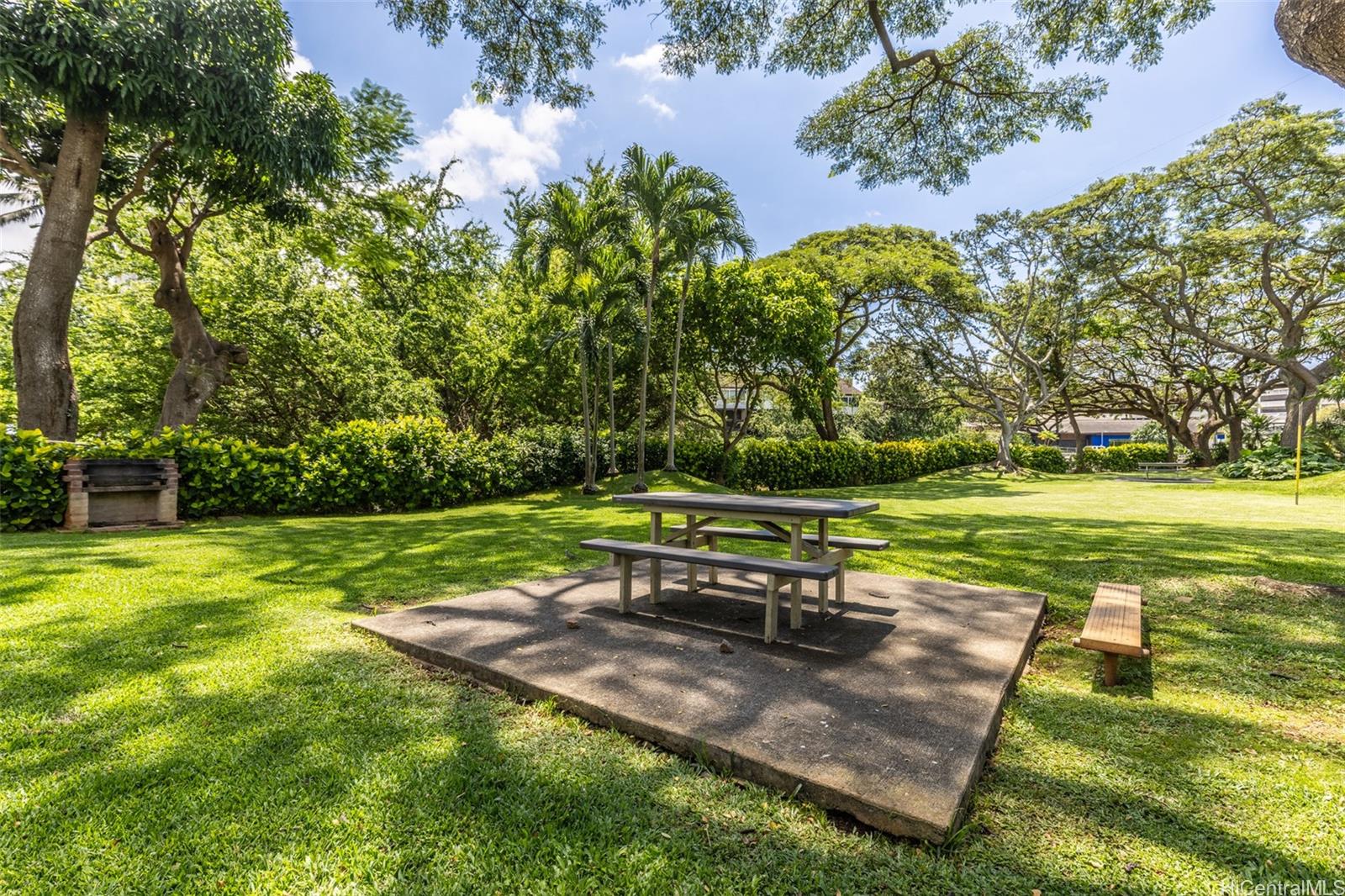98-1038 Moanalua Road, Unit 7608 Aiea, HI 96701 - Photo 23 of 25 a park bench sitting in the middle of a park