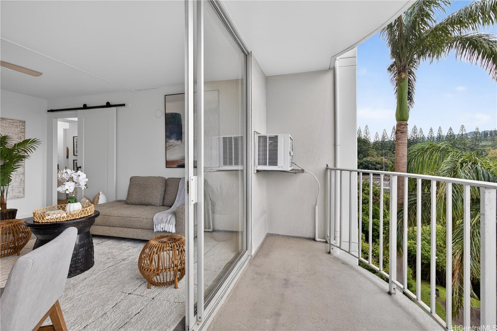 98-1038 Moanalua Road, Unit 7608 Aiea, HI 96701 - Photo 9 of 25 a balcony with furniture and a potted plant