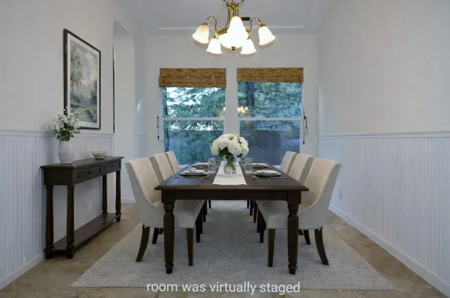 a view of a dining room with furniture window and outside view