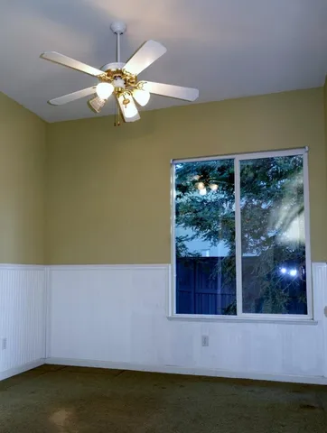 a view of wooden floor and cabinet in a room