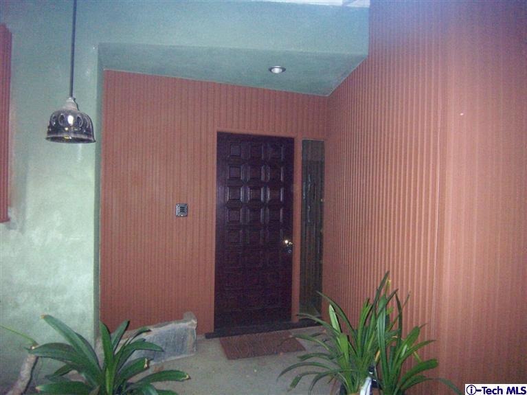 Undisclosed Address Pasadena, CA 91103 - Photo 2 of 33 a potted plant in front of a door