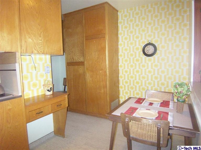 Undisclosed Address Pasadena, CA 91103 - Photo 11 of 33 a bedroom with a bed and a table