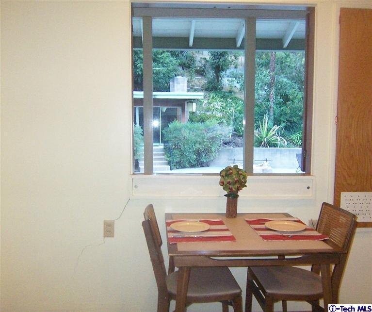 Undisclosed Address Pasadena, CA 91103 - Photo 12 of 33 a table and chairs in a dining room with a window