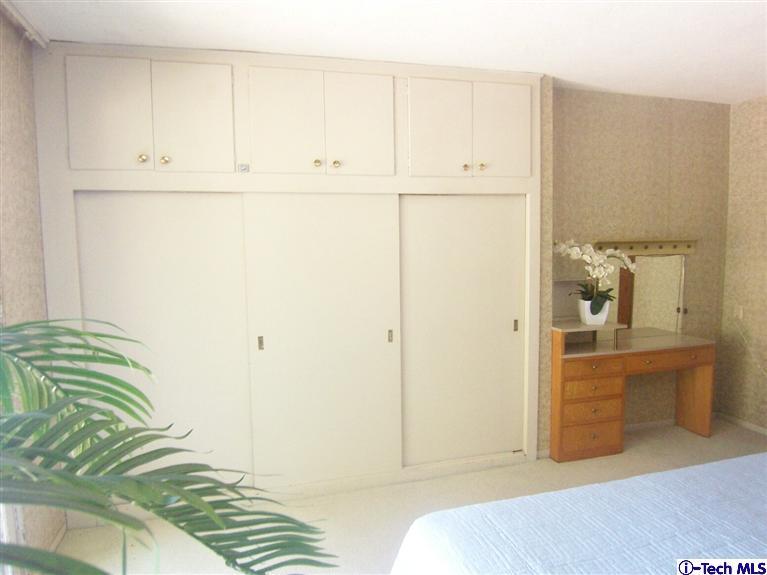 Undisclosed Address Pasadena, CA 91103 - Photo 17 of 33 a bedroom with a bed and cabinets