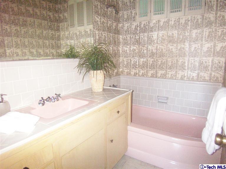 Undisclosed Address Pasadena, CA 91103 - Photo 22 of 33 a bathroom with a tub sink and a mirror