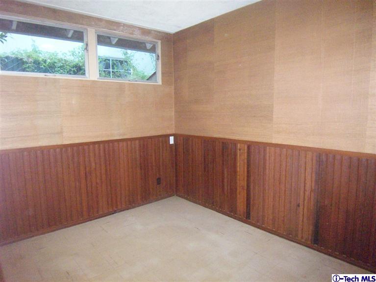 Undisclosed Address Pasadena, CA 91103 - Photo 24 of 33 an empty room with wooden floor and windows