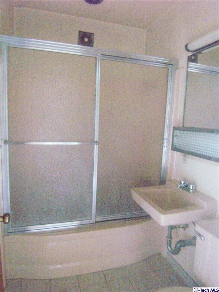 Undisclosed Address Pasadena, CA 91103 - Photo 27 of 33 a bathroom with a sink and a mirror