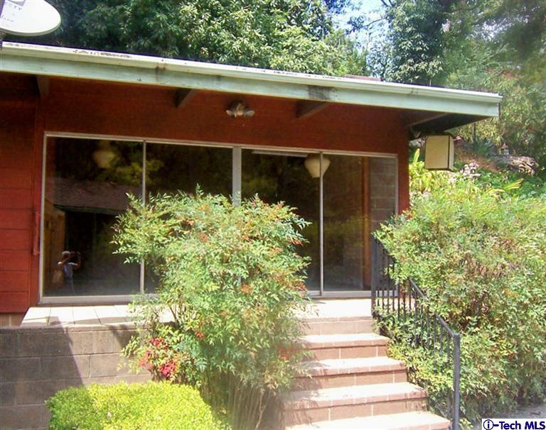 Undisclosed Address Pasadena, CA 91103 - Photo 29 of 33 a front view of a house with a yard