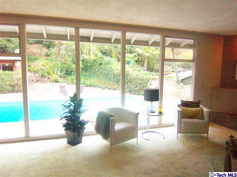 Undisclosed Address Pasadena, CA 91103 - Photo 6 of 33 a living room with furniture potted plant and a large window