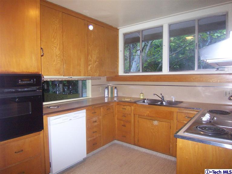 Undisclosed Address Pasadena, CA 91103 - Photo 8 of 33 a kitchen with a sink and large window