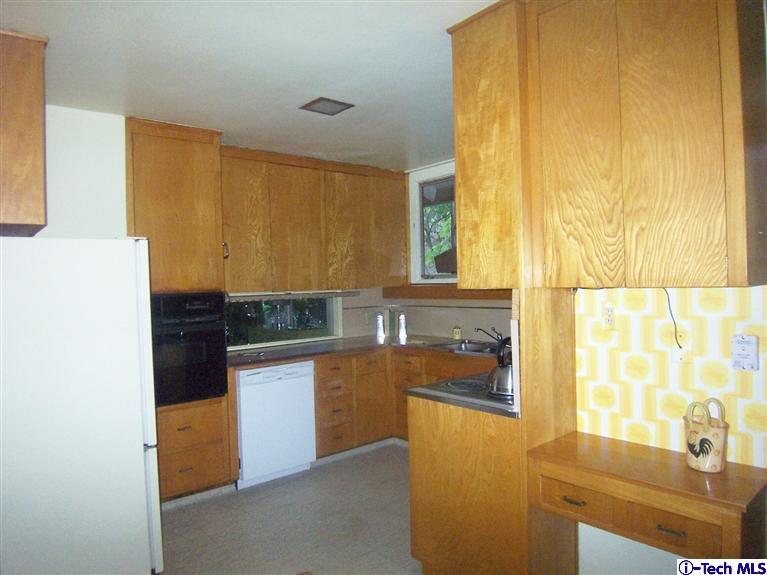 Undisclosed Address Pasadena, CA 91103 - Photo 9 of 33 a kitchen with stainless steel appliances granite countertop a refrigerator and a stove