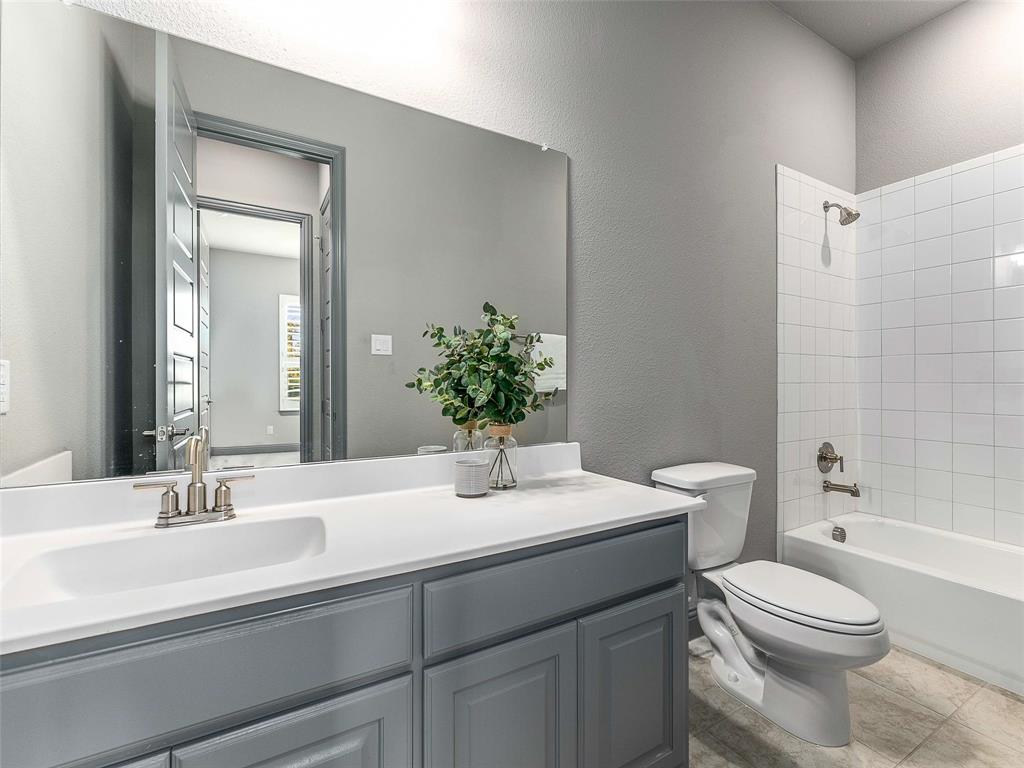 1930 Inwood Lane Prosper, TX 75078 - Photo 20 of 37 a bathroom with a sink a toilet and shower