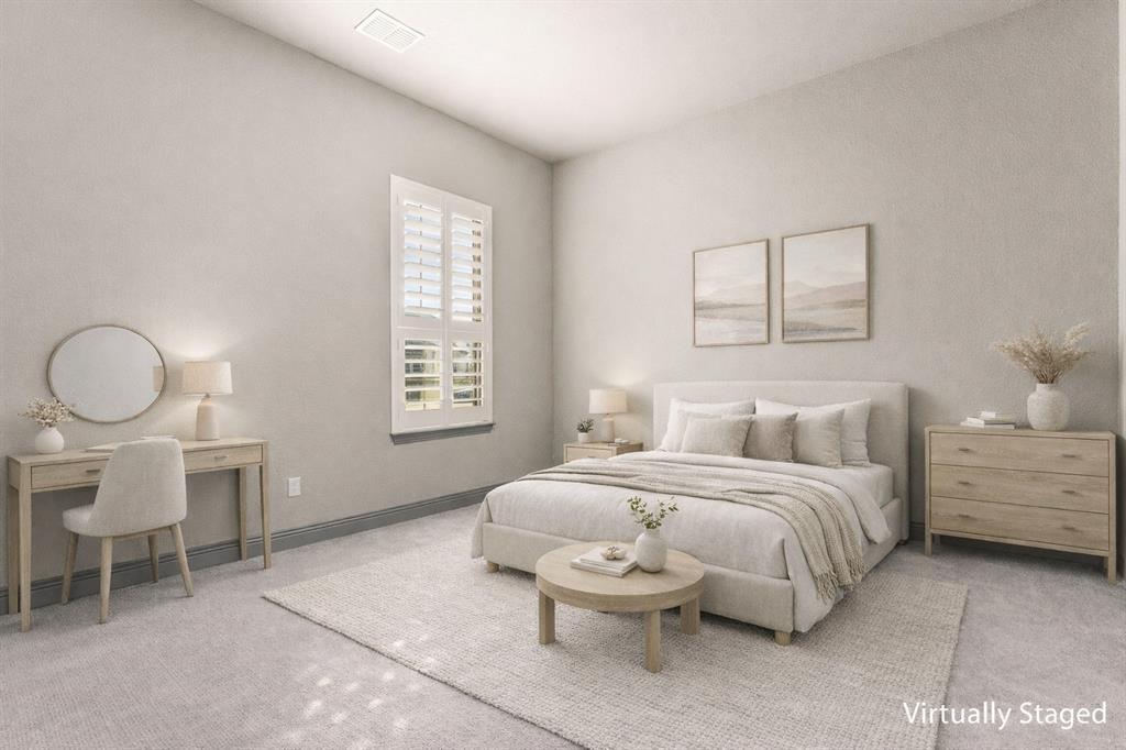 1930 Inwood Lane Prosper, TX 75078 - Photo 21 of 37 a bedroom with a bed and a chandelier