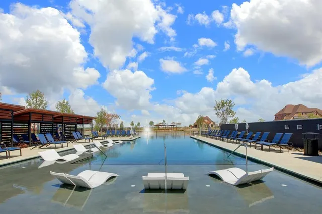 a view of a swimming pool and an outdoor space