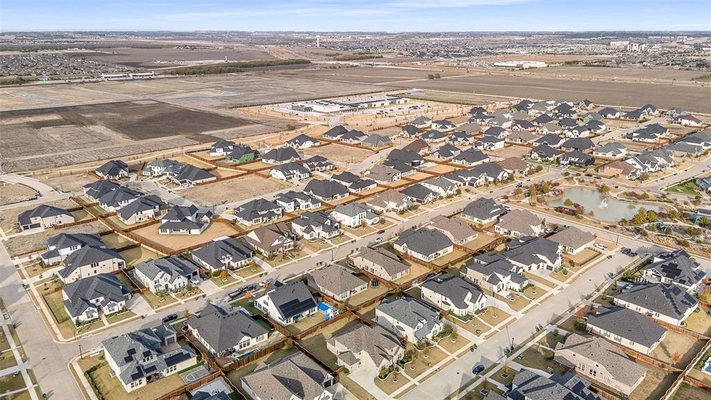 1930 Inwood Lane Prosper, TX 75078 - Photo 36 of 37 an aerial view of residential building with ocean view