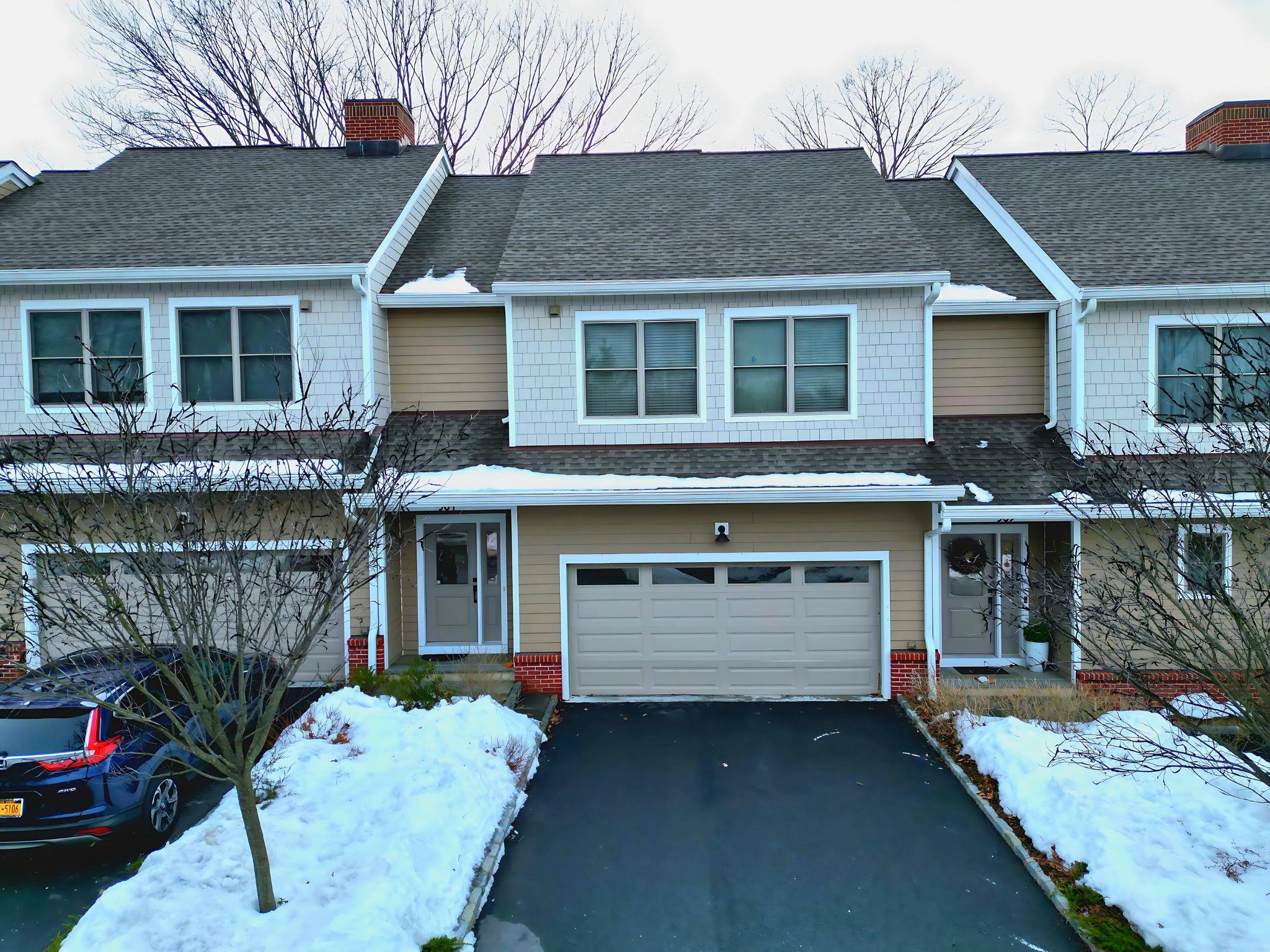 304 Boulder Ridge Road South Salem, NY 10590 - Photo 1 of 1 Multi unit property featuring aphalt driveway, roof with shingles, brick siding, a chimney, and a garage