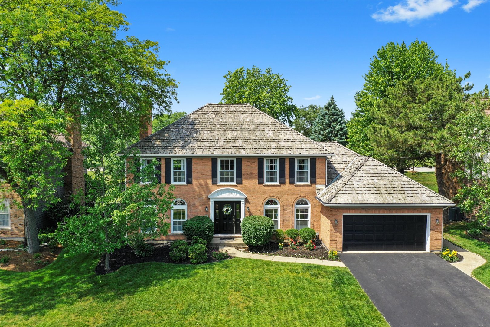 front view of a house with a yard