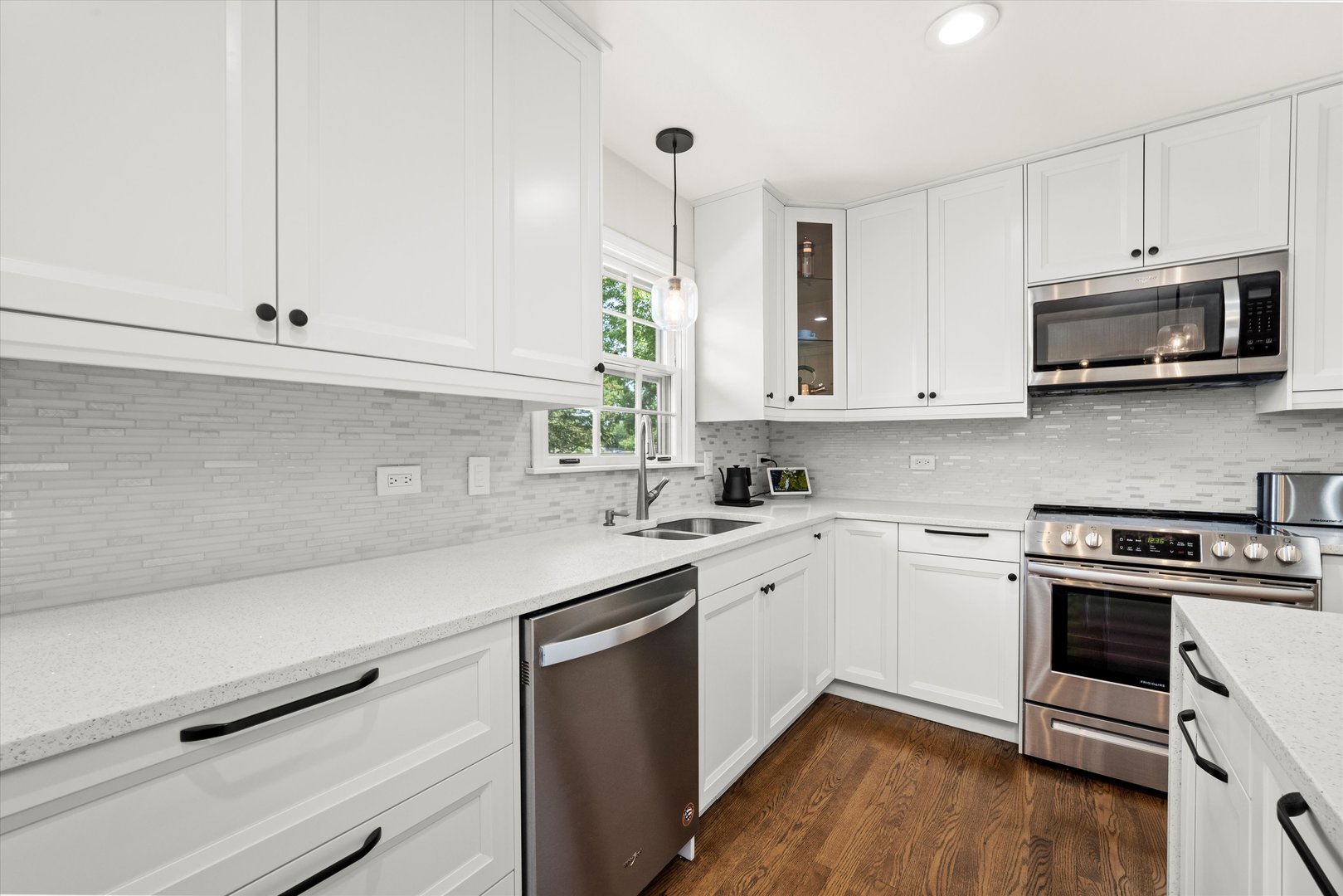 211 Danada Drive Wheaton, IL 60189 - Photo 11 of 51 a kitchen with stainless steel appliances white cabinets and a sink