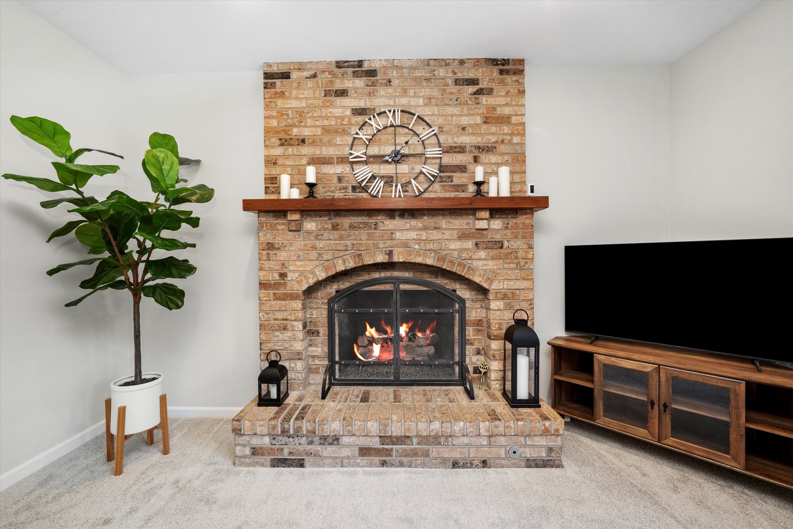 211 Danada Drive Wheaton, IL 60189 - Photo 16 of 51 a living room with a fireplace and a flat screen tv