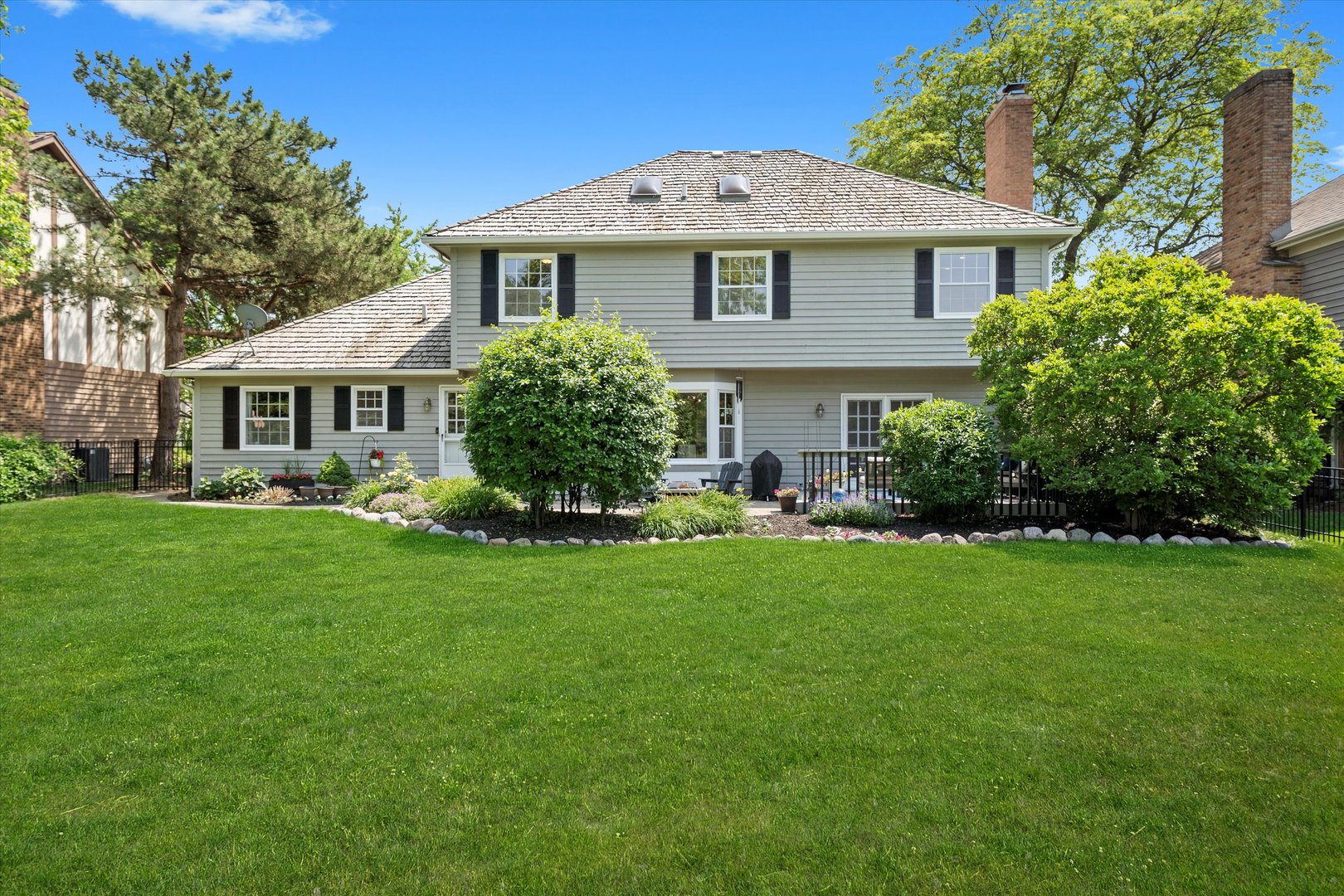 211 Danada Drive Wheaton, IL 60189 - Photo 41 of 51 a front view of a house with a garden and yard