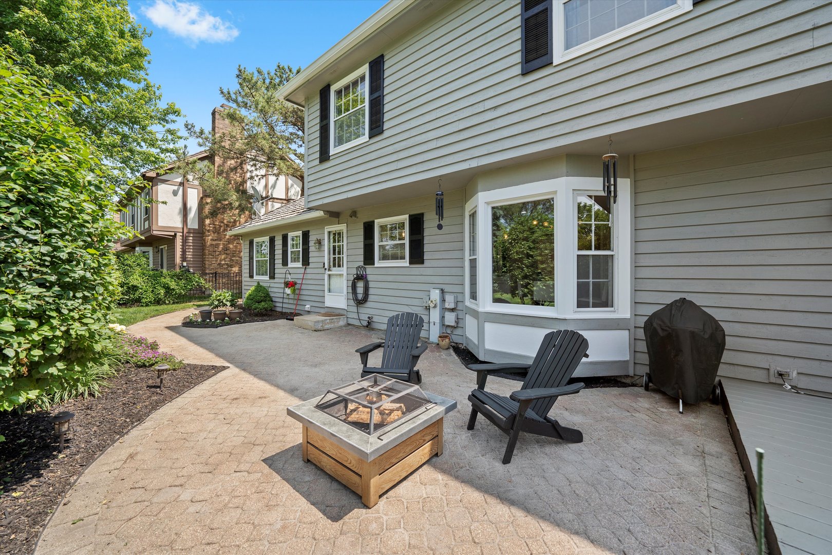 211 Danada Drive Wheaton, IL 60189 - Photo 43 of 51 a view of a patio with couches table and chairs and potted plants