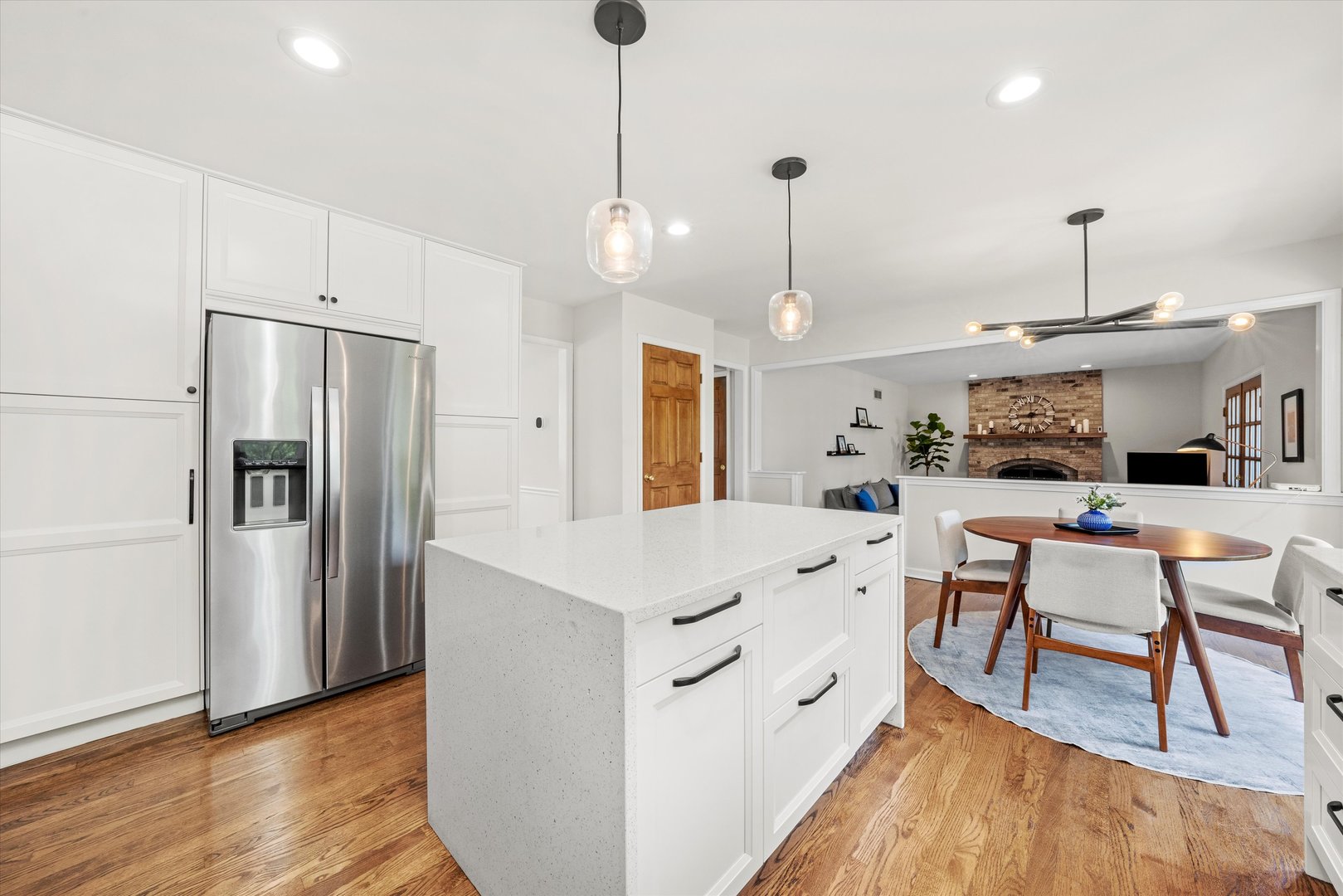 211 Danada Drive Wheaton, IL 60189 - Photo 10 of 51 a kitchen with stainless steel appliances sink refrigerator dining table and chairs