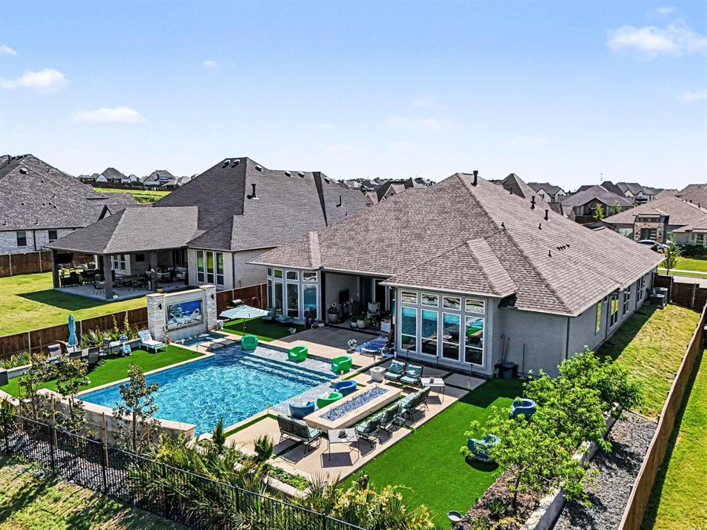 573 Broadleaf Way Haslet, TX 76052 - Photo 3 of 35 a aerial view of a house with swimming pool and a yard