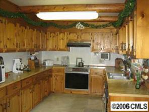 1045 Arabian Farm Road Clover, SC 29710 - Photo 2 of 8 a kitchen with a sink and cabinets
