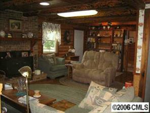 1045 Arabian Farm Road Clover, SC 29710 - Photo 4 of 8 a living room with furniture and a fireplace