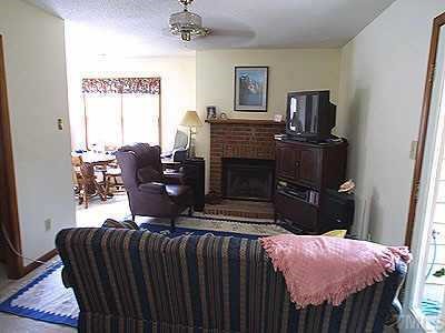3333 Mill Run Raleigh, NC 27612 - Photo 1 of 1 a bedroom with furniture and a fireplace