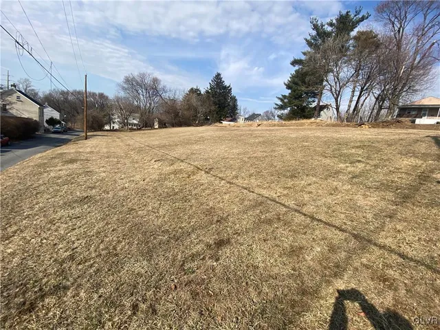 a view of road with houses