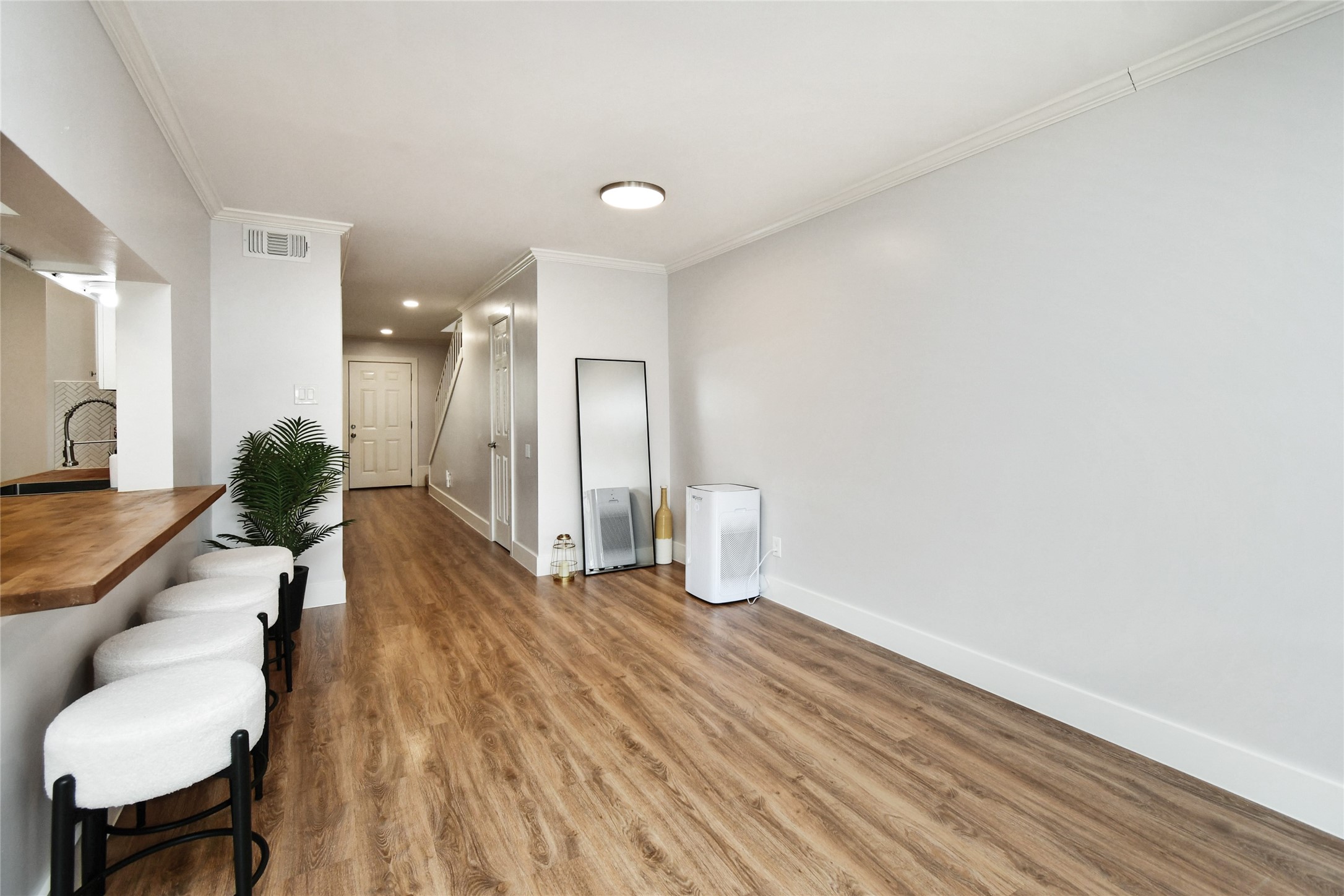 6426 Kentwick Drive, Unit 24/4 Houston, TX 77084 - Photo 13 of 36 a view of a livingroom with furniture and wooden floor
