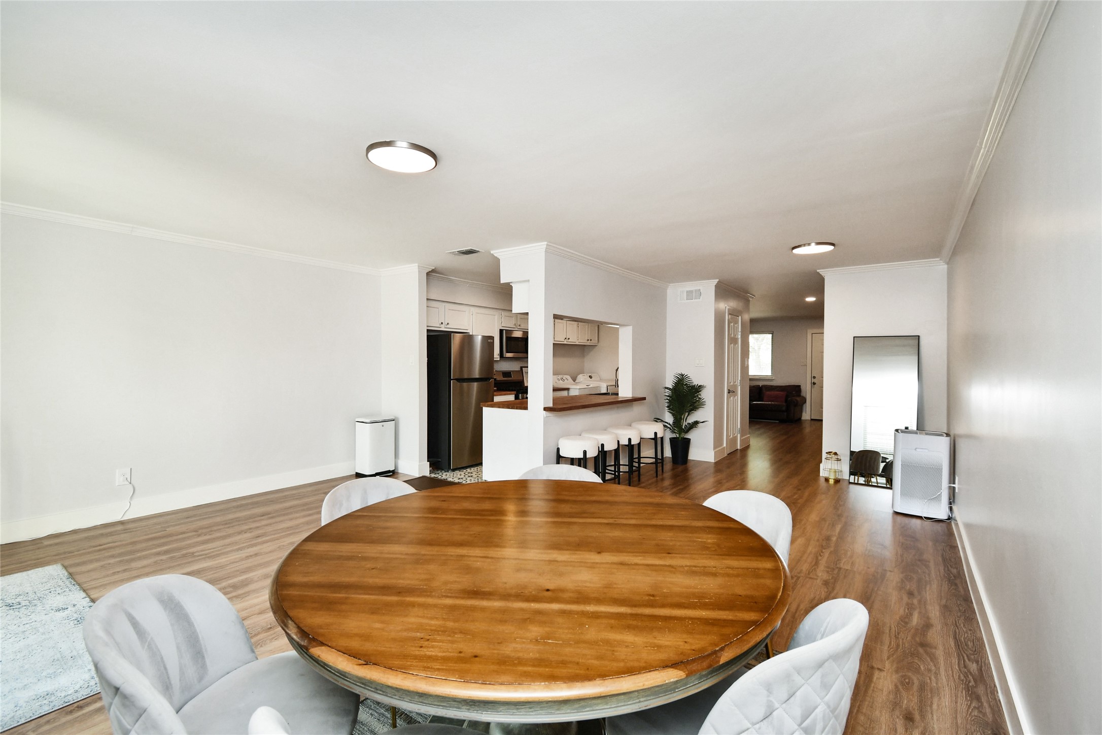 6426 Kentwick Drive, Unit 24/4 Houston, TX 77084 - Photo 18 of 36 a room with dining room and wooden floor