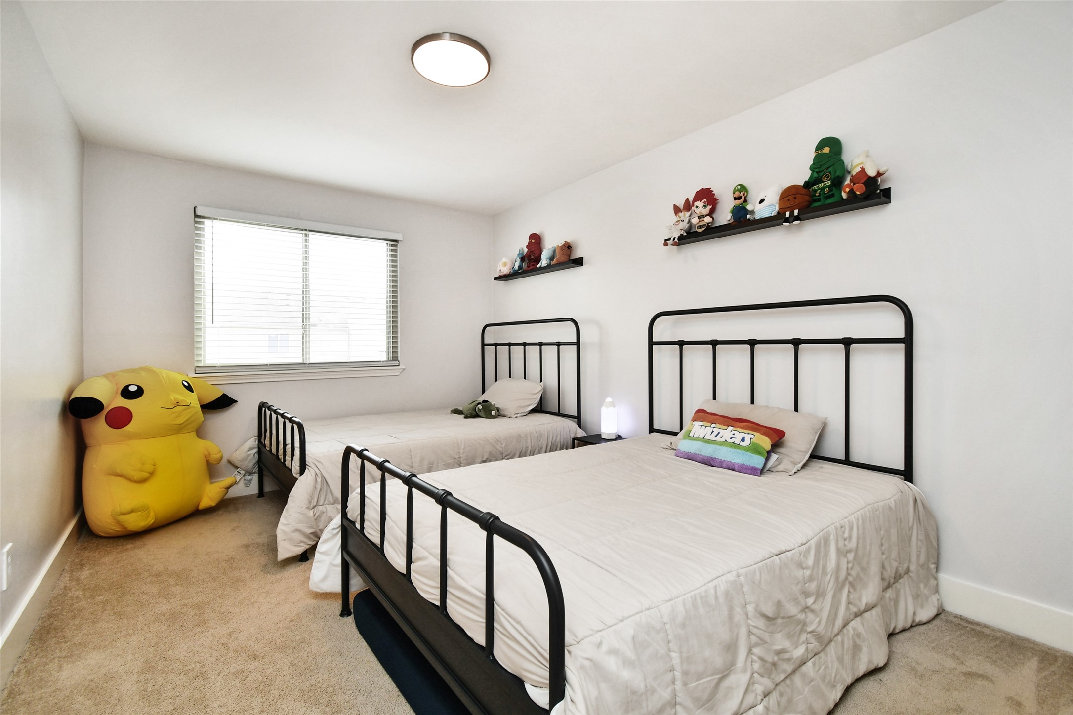 6426 Kentwick Drive, Unit 24/4 Houston, TX 77084 - Photo 26 of 36 a bedroom with two beds and a window