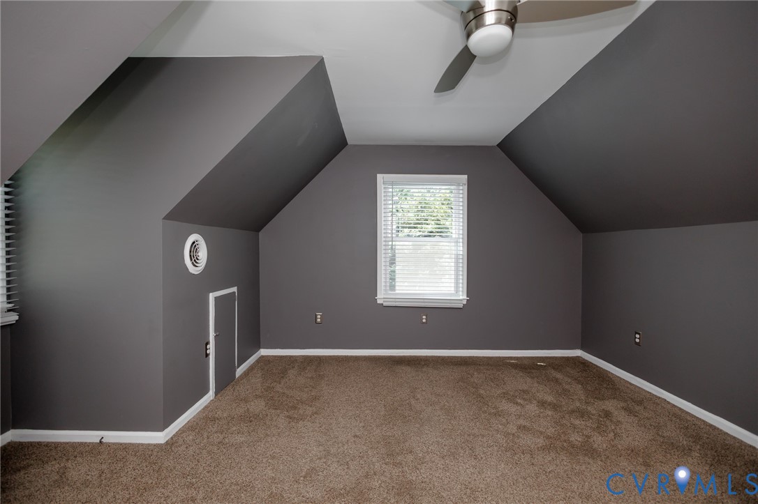 20520 Cox Road Sutherland, VA 23885 - Photo 26 of 31 Carpeted room with sloped ceilings, a window with