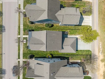 an aerial view of a house with outdoor space